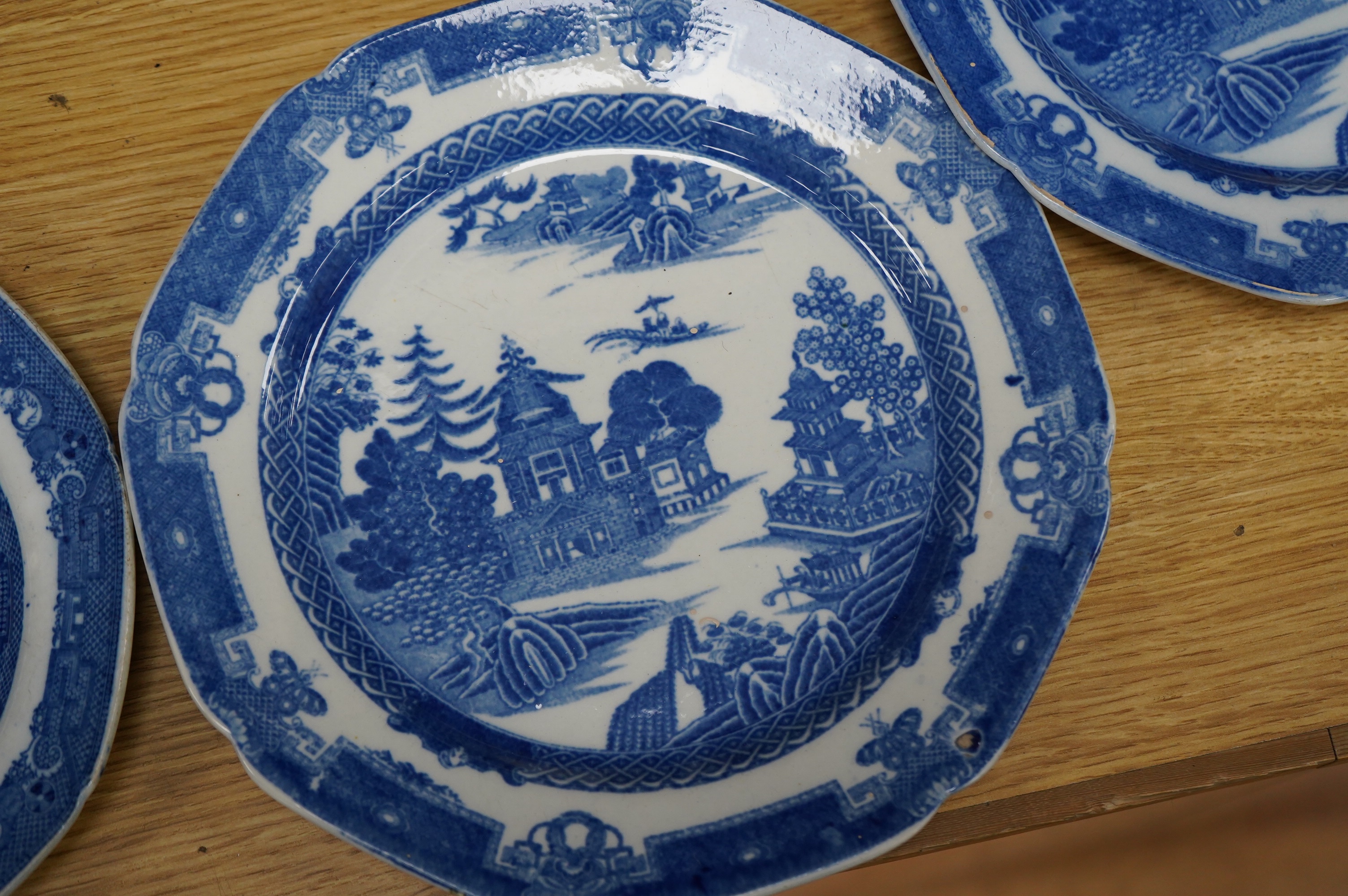 Four early 19th century English pearlware blue and white plates, largest 23.5cm. Condition - fair
